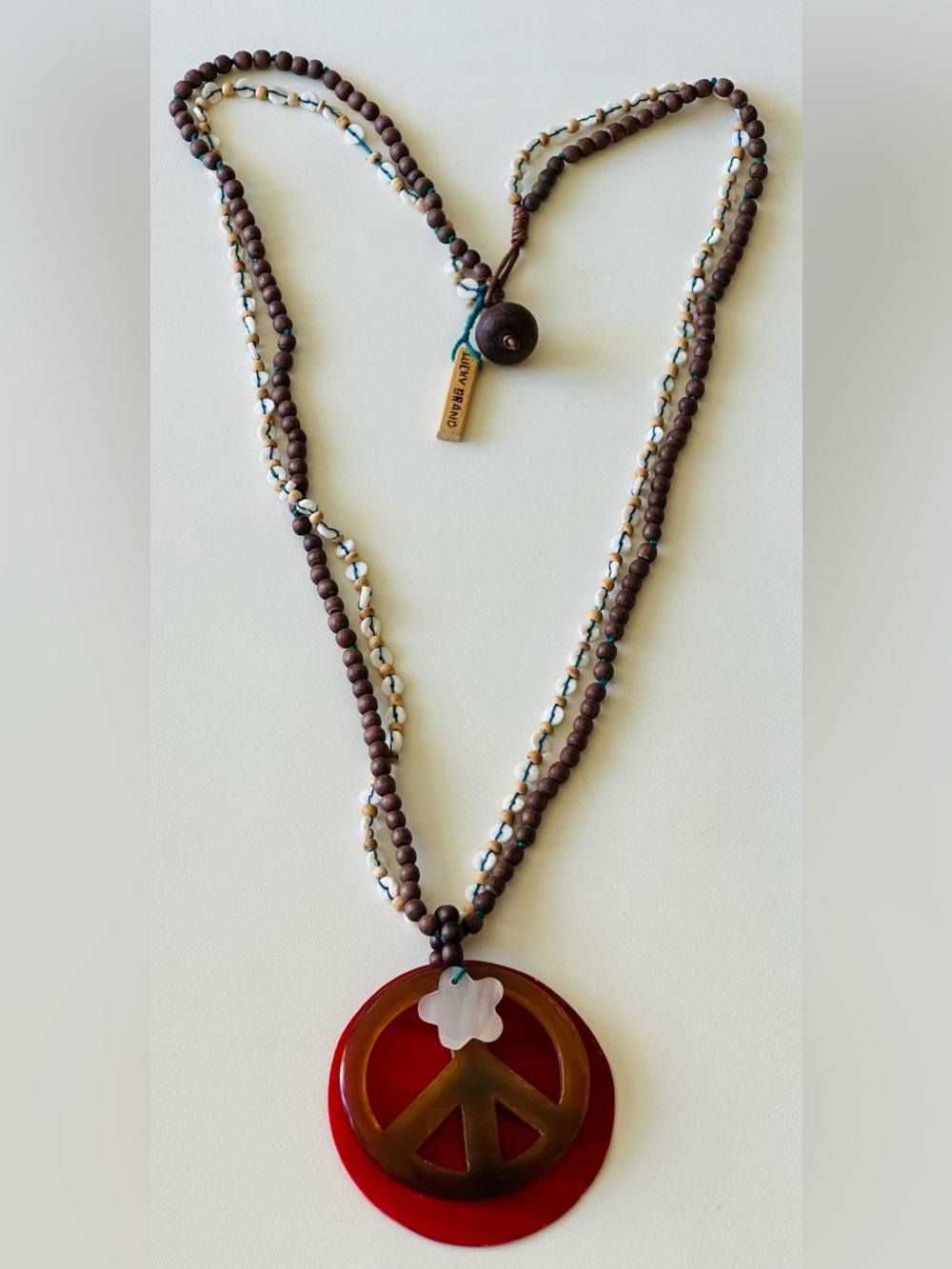 Lucky Brand Brown Bead Necklace with Red Peace Pendant